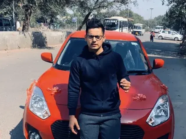 Past student with his new red car
